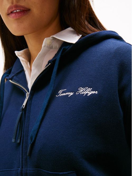 Buzo multicolor con capota y cremallera