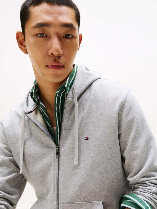 Buzo gris con capota y cremallera